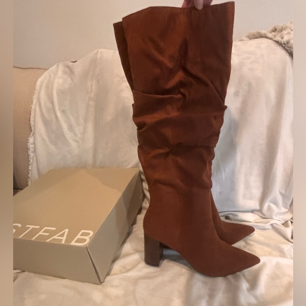 Size 8.5 heeled booties, brown, suede feel. New in box
